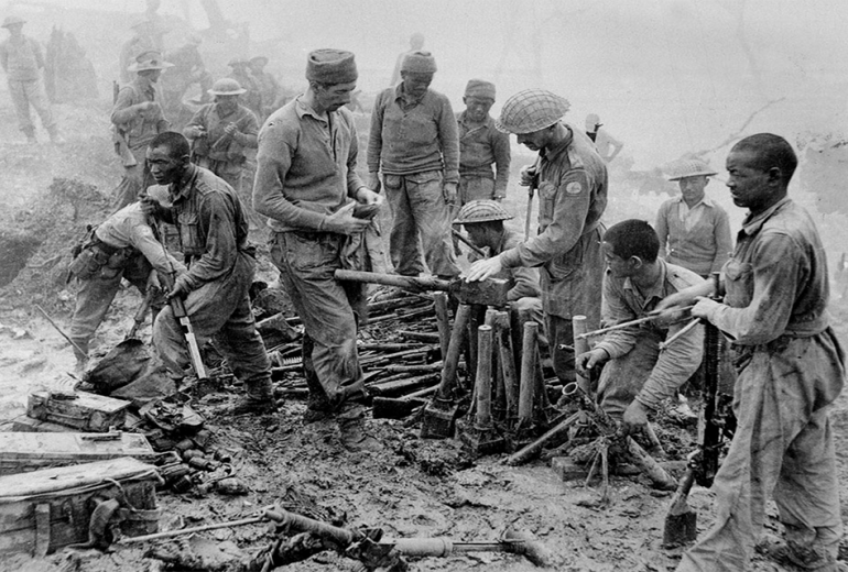 Indian and Gurkha soldiers inspect captured Japanese ordnance during the Imphal-Kohima battle, 1944. (The National Archives UK)