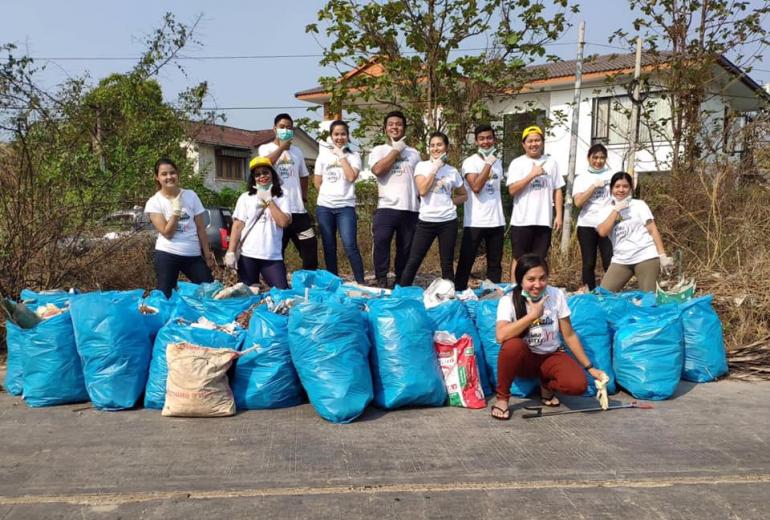 Clean Yangon members tidy trash in Hlaingthaya township. (Clean Yangon / Facebook)