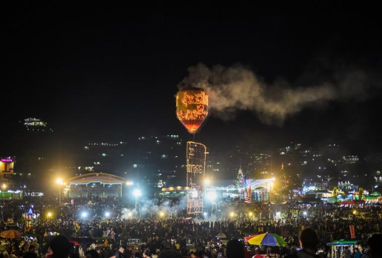 Participants release a hot-air balloon attached with small lanterns during the Tazaungdaing Lighting Festival at Taunggyi in Myanmar's northeastern Shan State. (Ye Aung Thu / AFP)