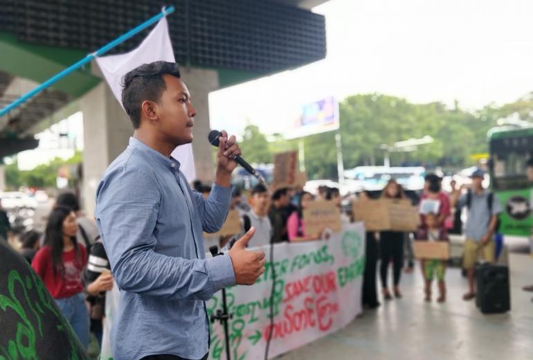 Psychology student Kyaw Ye Htet, who helped start Fridays for Future Myanmar, talks to the rally on Friday, May 31. (Myanmar Mix)