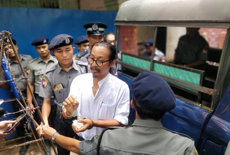 Mint Htin Ko Ko Gy speaks to media outside Insein township court on June 6. (Myanmar Mix)