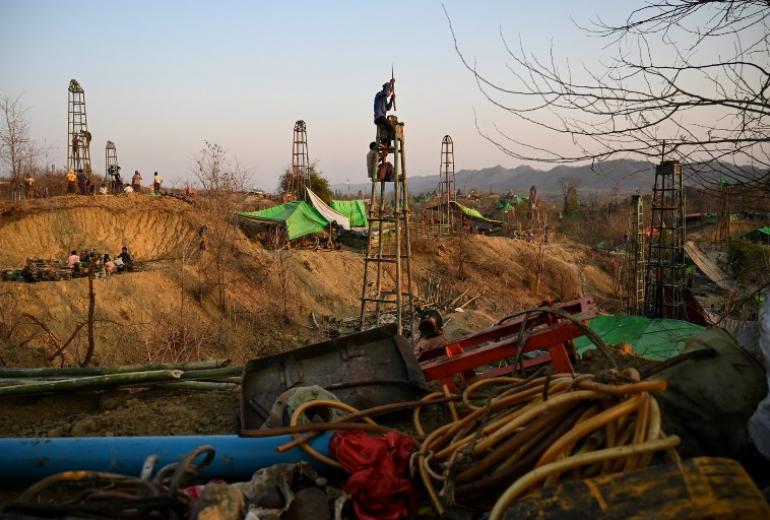 Workers build a new oil rig at an informal oil field in Minhla township, central Myanmar. (Ye Aung Thu / AFP)