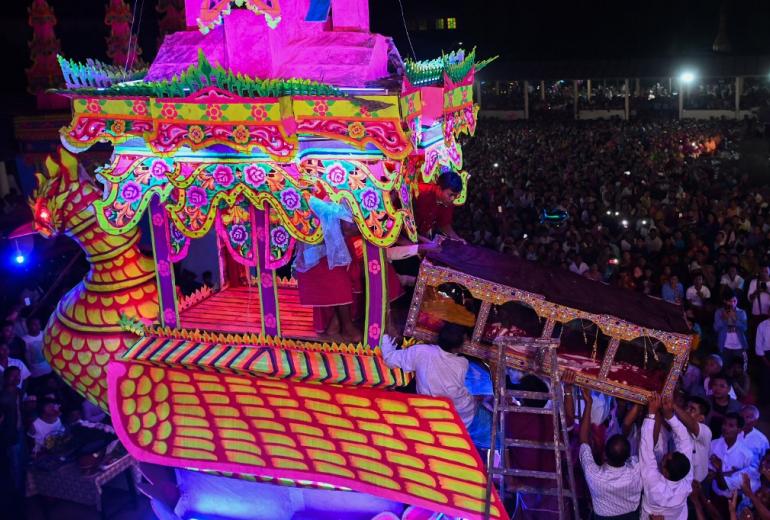 Devotees carry the coffin of abbot Kay Lar Tha during his funeral in Mudon, Mon State on March 31. (Ye Aung Thu / AFP)