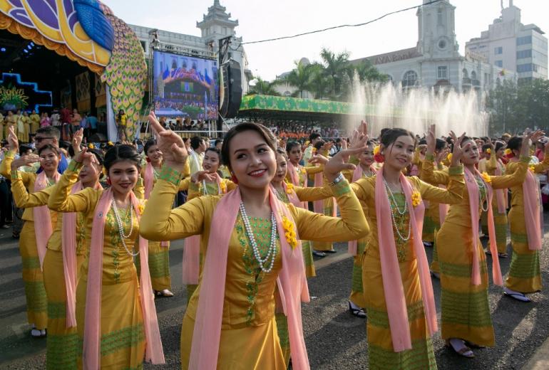  Dancers in traditional costumes perform during celebrations for the Thingyan festival, also known as the Buddhist New Year near Sule Pagoda on April 13. (Sai Aung / AFP)