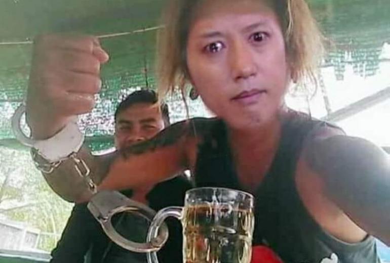 The face of rapper and actor Sai Sai Kham Leng superimposed over a man handcuffed to what may well be a mug of herbal tea.