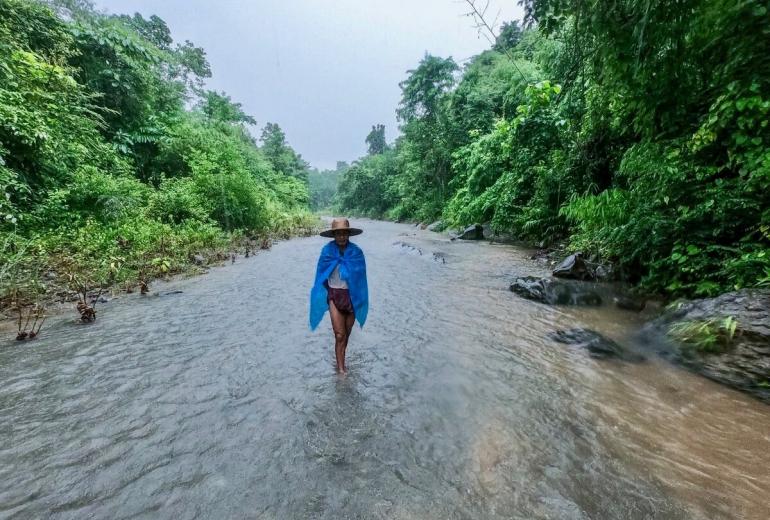 A local farmer leads the way to a huge waterfall buried deep within the mountainous jungle that separates Ayeyarwady region and Rakhine state. (Dominic Horner)