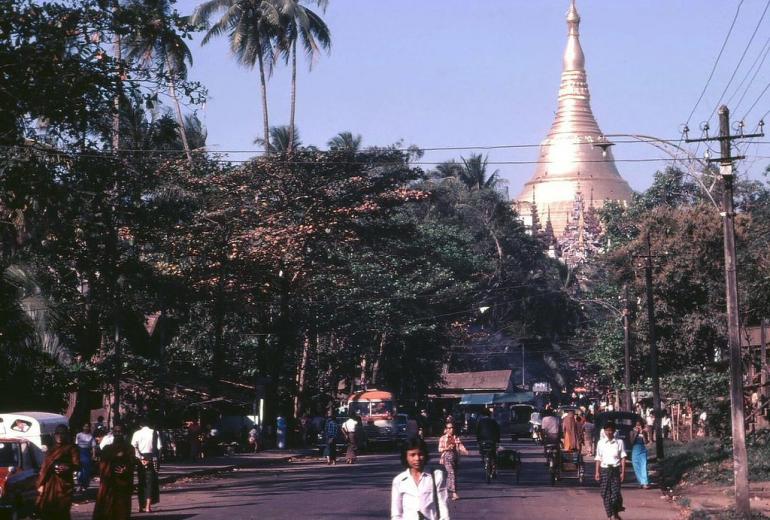 Yangonites go about their daily business, with Shwedagon pagoda in the background. (Peter Ward)