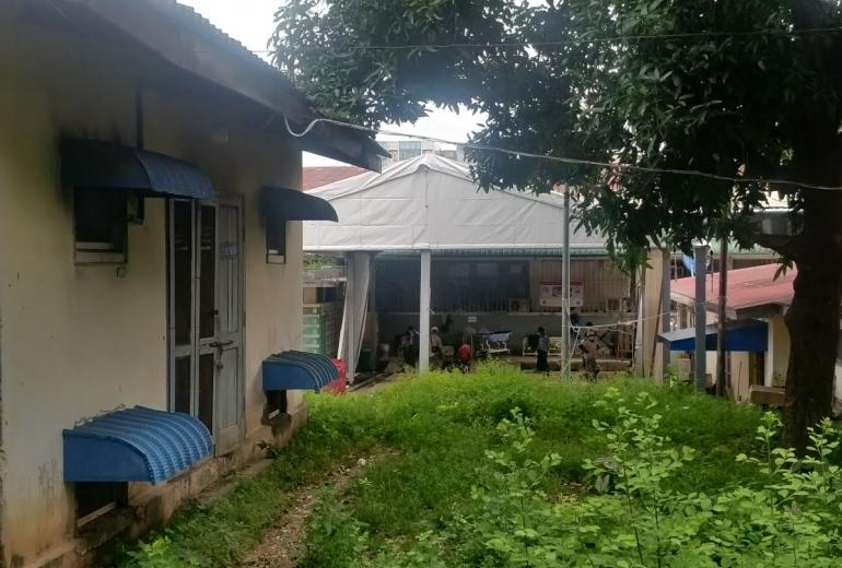 Workers erect a medical tent in the western part of the Yangon General Hospital compound on September 14. (Myanmar Mix)