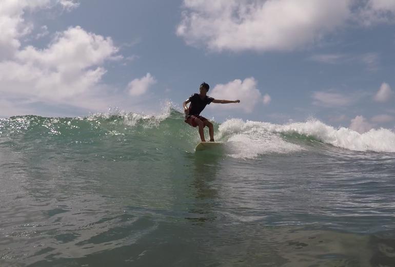 Local surfer Lwin Ko Ko Htet rides a wave on a beach near Ngwe Saung. (Csiga Balazs)