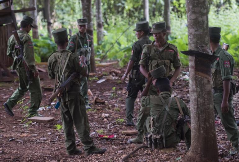  Members of the United Wa State Army taking a rest in the rubber planting in Poung Par Khem region, near the Thailand and Myanmar border on June 26, 2017. (Ye Aung Thu / AFP)