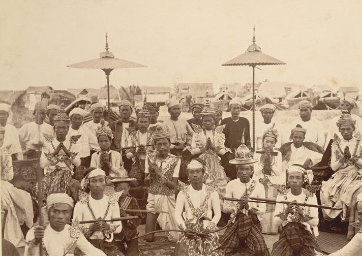 Photograph of a theatrical troupe in Burma, taken by Watts and Skeen in the 1890s, from the Curzon Collection.