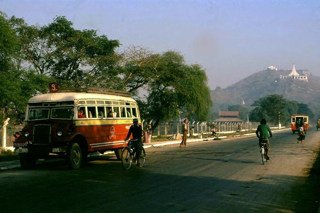 Traffic in Mandalay, with Mandalay Hill in the backdrop.