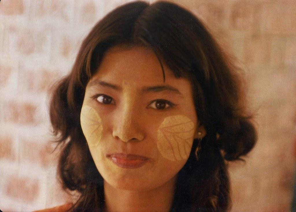 A woman in Mandalay smiles at the camera.