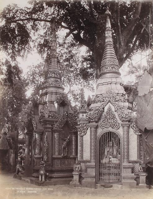 A Buddha statue at the foot of Shwedagon Pagoda. (1906)