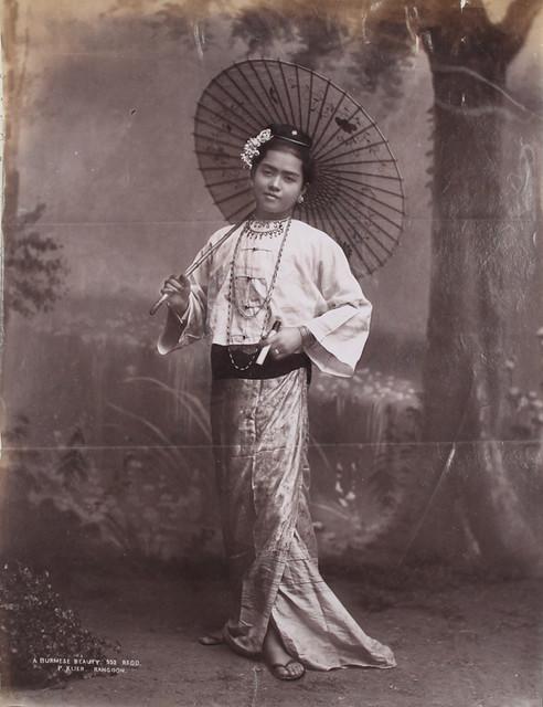 A woman poses for a portrait that Klier labelled &quot;A Burmese Beauty.&quot; (1906)