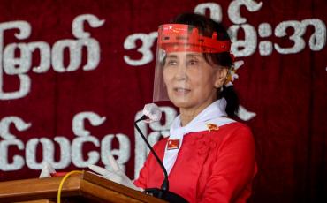 Myanmar's political leader Aung San Suu Kyi wears a face shield as she attends a ceremony to mark the 32nd anniversary of the National League for Democracy (NLD) in Naypyidaw on September 27, 2020. (Thet Aung / AFP)