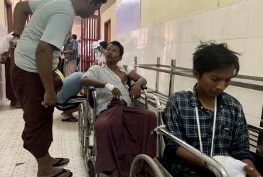 Injured people from Kyauk Tan village in Rathedaung township wait in a hospital in Rakhine state's capital Sittwe in western Myanmar on May 2, 2019, after the army opened fire on a group of ethnic Rakhine detainees at a school in the village. (STR / AFP)