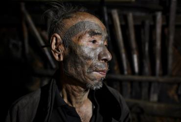  This photo taken on February 9, 2020 shows Nok Tan, 75, a tattooed Konyak tribeman, in his house in a village in Sagaing region of Myanmar, wedged in a semi-autonomous zone near the Indian border. (Photos by Ye Aung Thu / AFP)