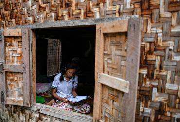 This photo taken on June 20, 2020 shows 18-year-old Muslim May Thandar Maung, who says she hasn't been able to get an ID card because of her religion and hence unable to vote in the upcoming election, studying Arabic and religion in her home in Meiktila. (Ye Aung Thu / AFP)