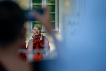 Buddhist monk Wirathu talks to his followers before turning himself in at a Yangon police station on November 2, 2020. (Sai Aung Main / AFP)