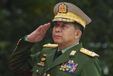 Myanmar's Chief Senior General Min Aung Hlaing, commander-in-chief of the Myanmar armed forces, salutes to pay his respects to Myanmar independence hero General Aung San and eight others assassinated in 1947, during a ceremony to mark the 71th anniversary of Martyrs' Day in Yangon. (Ye Aung Thu / AFP)
