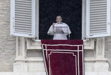Pope Francis speaks from the window of the apostolic palace overlooking St. Peter's Squsre during the weekly Angelus prayer on February 7, 2021 in the Vatican, during the Covid-19 pandemic. (Filippo Monteforte / AFP)