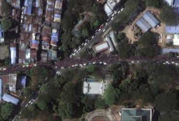 This handout satellite image released by Maxar Technologies shows a close-up of protesters along Kyun Taw Road, near Myanmar Radio and TV center in Yangon on February 8, 2021.