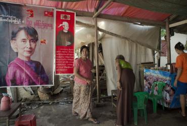  A poster bearing a portrait of Myanmar opposition leader Aung San Suu Kyi (L) is seen at a tea and coffee shop in Yangon on November 12, 2015.. (Nicolas Asfouri / AFP)