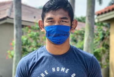Aung La Nsang posted this photo of himself on Facebook along with photographs of a positive reading of the virus from a Covid-19 test he took.