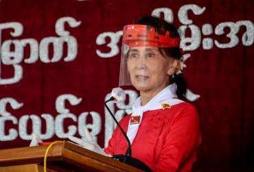 Myanmar's political leader Aung San Suu Kyi wears a face shield as she attends a ceremony to mark the 32nd anniversary of the National League for Democracy (NLD) in Naypyidaw on September 27, 2020. (Thet Aung / AFP)