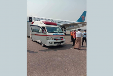 An ambulance collects a patient with the first suspected case of coronavirus in Myanmar from a runway at Yangon airport. (Facebook)