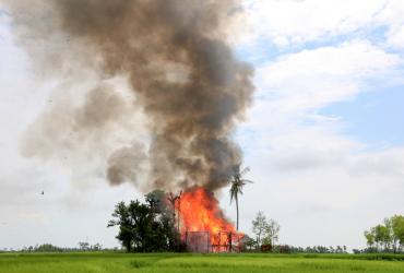 In this file photo taken on September 7, 2017, a house burns in Gawdu Tharya village near Maungdaw in Rakhine state. (AFP)