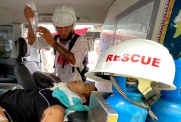 A wounded man is treated in an ambulance near Hledan Junction. (Supplied)