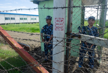 Myanmar border guard police stand at the gate of Nga Khu Ya camp in Maungdaw, Rakhine state. (AFP)