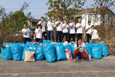 Clean Yangon members tidy trash in Hlaingthaya township. (Clean Yangon / Facebook)