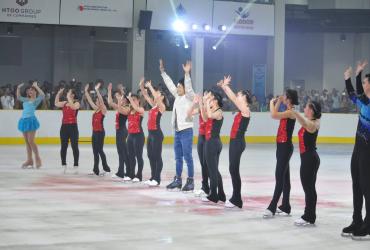 Skaters and a singer celebrate the opening on the rink. (Royal Sportainment Complex / Facebook) 