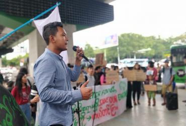 Psychology student Kyaw Ye Htet, who helped start Fridays for Future Myanmar, talks to the rally on Friday, May 31. (Myanmar Mix)