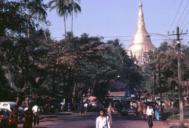 Yangonites go about their daily business, with Shwedagon pagoda in the background. (Peter Ward)