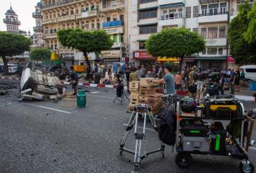 A production crew setting up a street scene during the filming of the movie Line Walker 2 near a pagoda in Yangon. (Sai Aung / AFP)