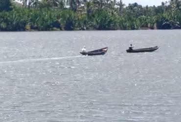 A 25-year-old man who tested positive for Covid-19 travels with his father in the front boat to a hospital in Rakhine state. 