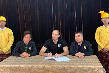 Dave Leduc (middle) signs with World Lethwei Championship on Saturday, March 9. (WLC / Facebook)