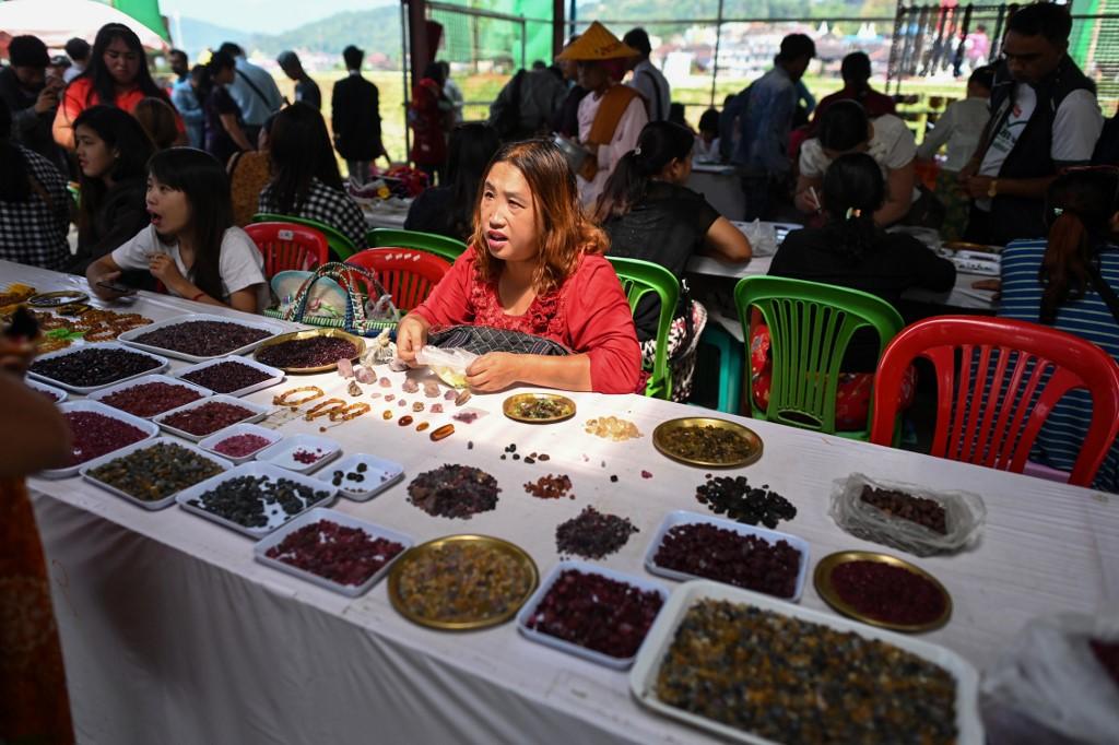 A seller trades rubies and other gemstones at the gems market in Mogok town, north of Mandalay. (Ye Aung Thu / AFP)