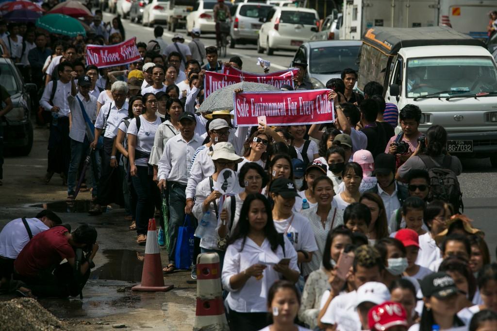 Protestors march towards the Central Investigation Department. (Sai Aung Main / AFP)