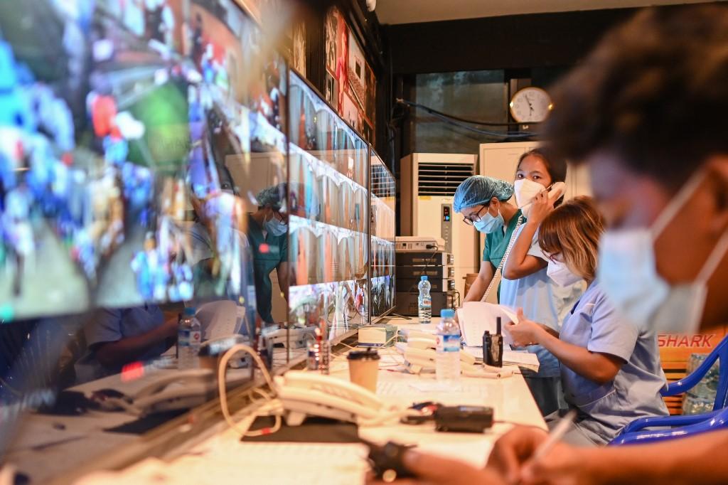 Healthcare workers working in the control room of the Ayeyarwady Covid Centre.