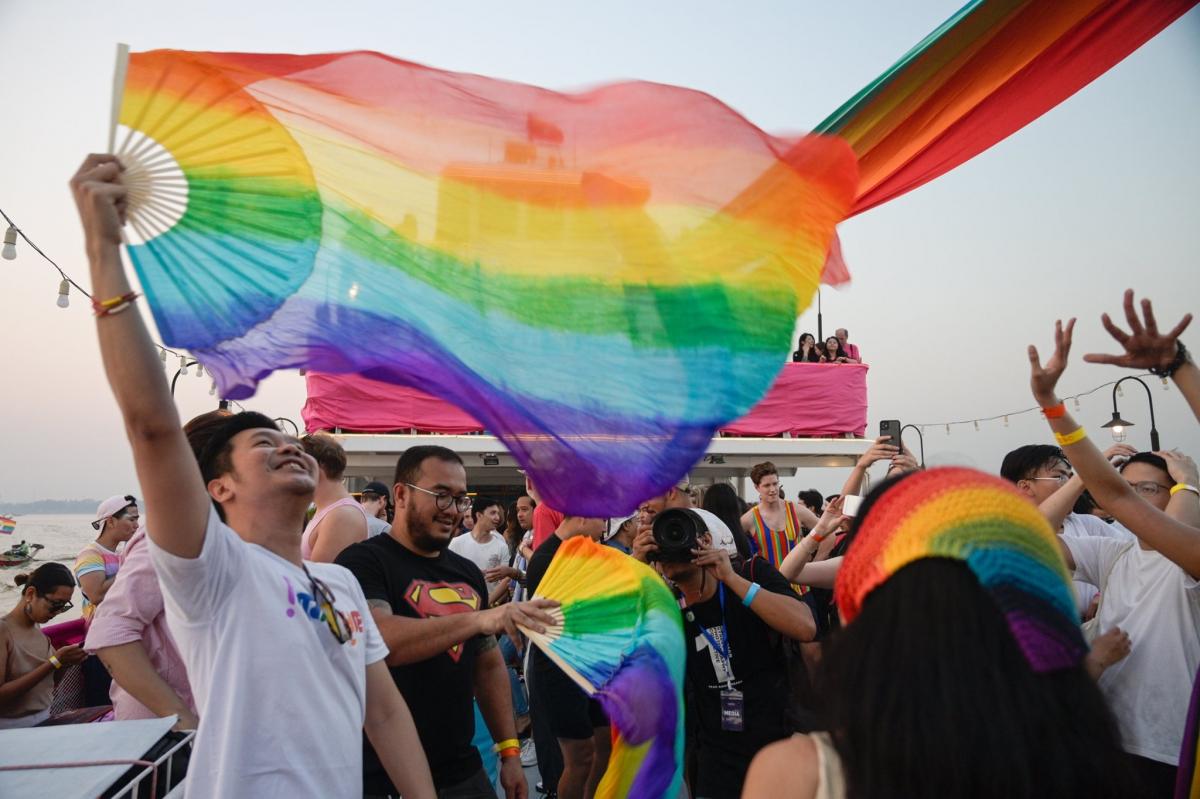 People celebrate Pride festival in a boat on the Yangon river. (Thet Htoo)