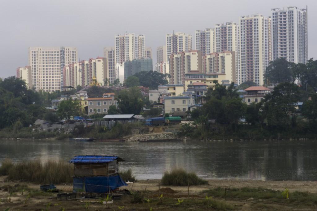 The river separating Myanmar’s Muse (foreground) and China’s Ruili (background)—two very different places. (Ye Aung Thu / AFP)