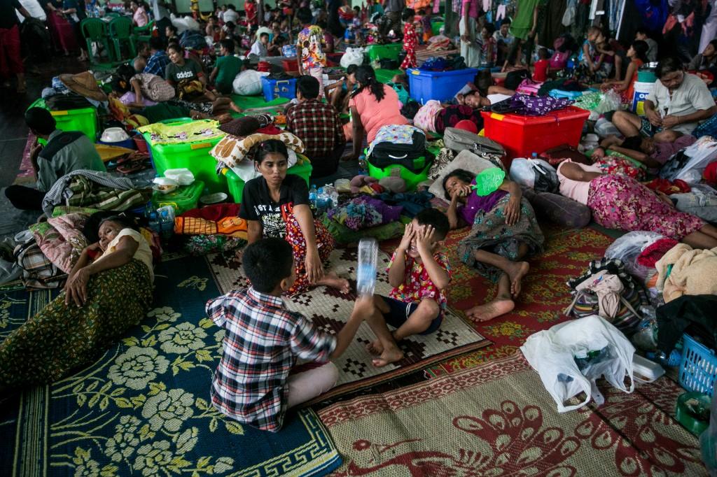 Displaced residents take shelter in a temporary evacuation centre as floodwaters submerged areas of Ye township in Mon State on August 11, 2019. (Sai Aung Main / AFP)