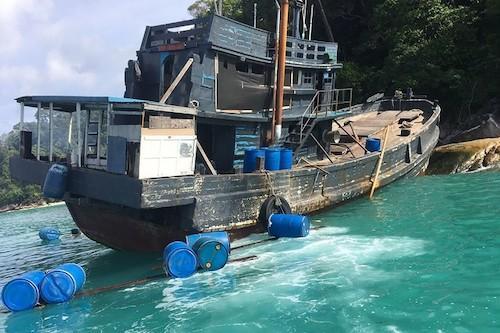 This handout picture taken on June 11, 2019 and released by Department of National Parks, Wildlife and Plant Conservation (DNP) on June 12 shows a boat at the Tarutao Marine National Park on Rawi island, southern Thailand. (DNP/AFP)