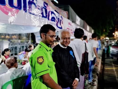  Myint Thein (right) with an emergency service volunteer. (Myanmar Mix)