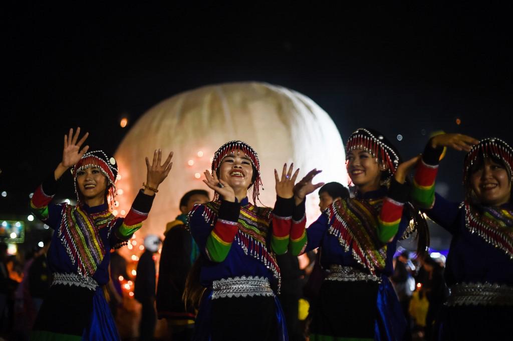 Wa ethnic women perform a traditional dance during the opening ceremony of the Tazaungdaing Lighting Festival at Taunggyi. (Ye Aung Thu / AFP)